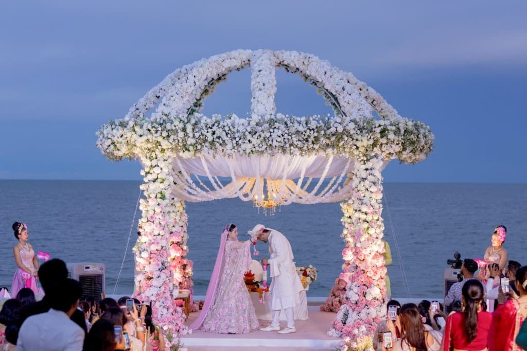 Elegant luxury Indian wedding floral mandap by the sea